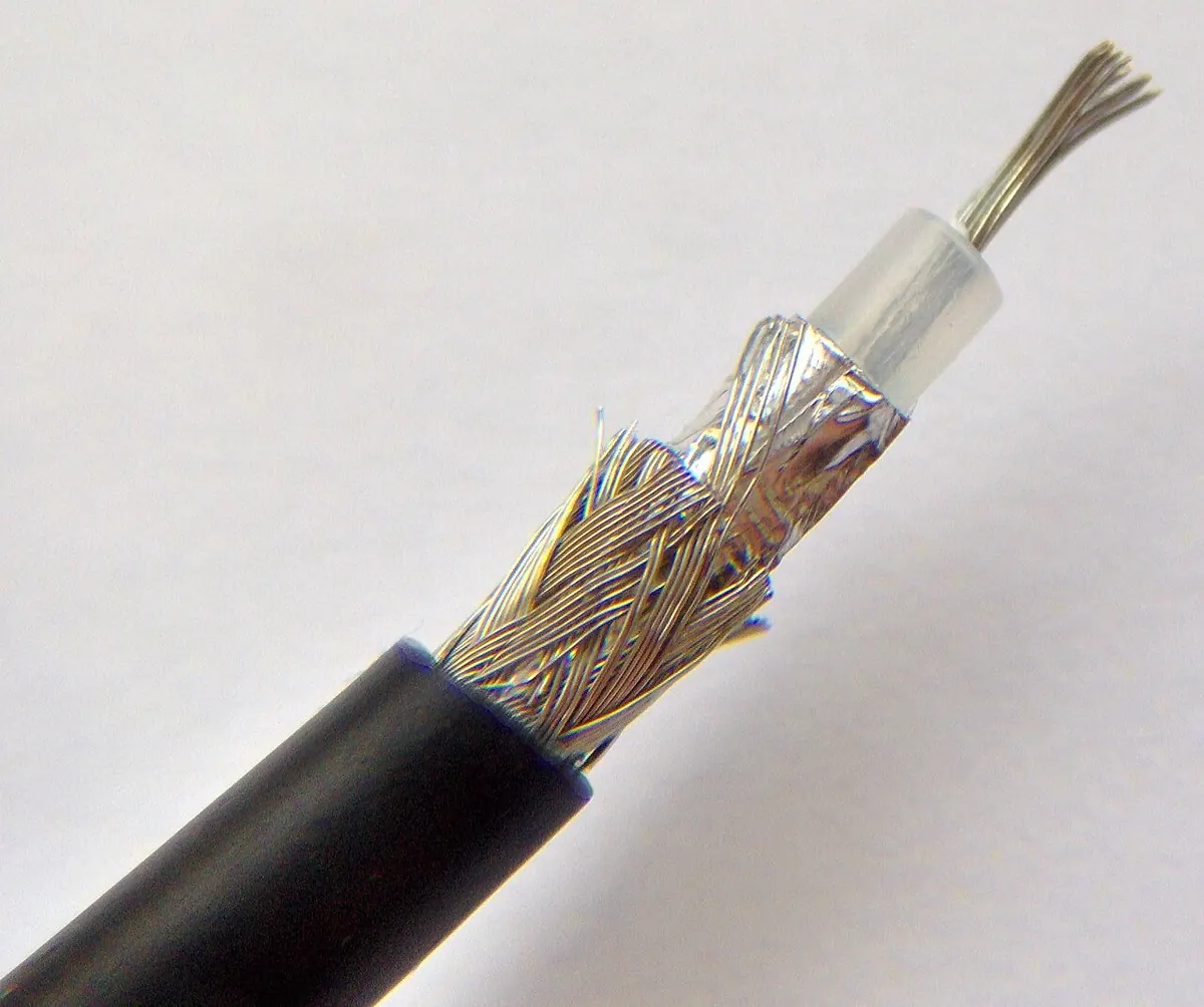 Cut coaxial cable showing its copper core and braided shield