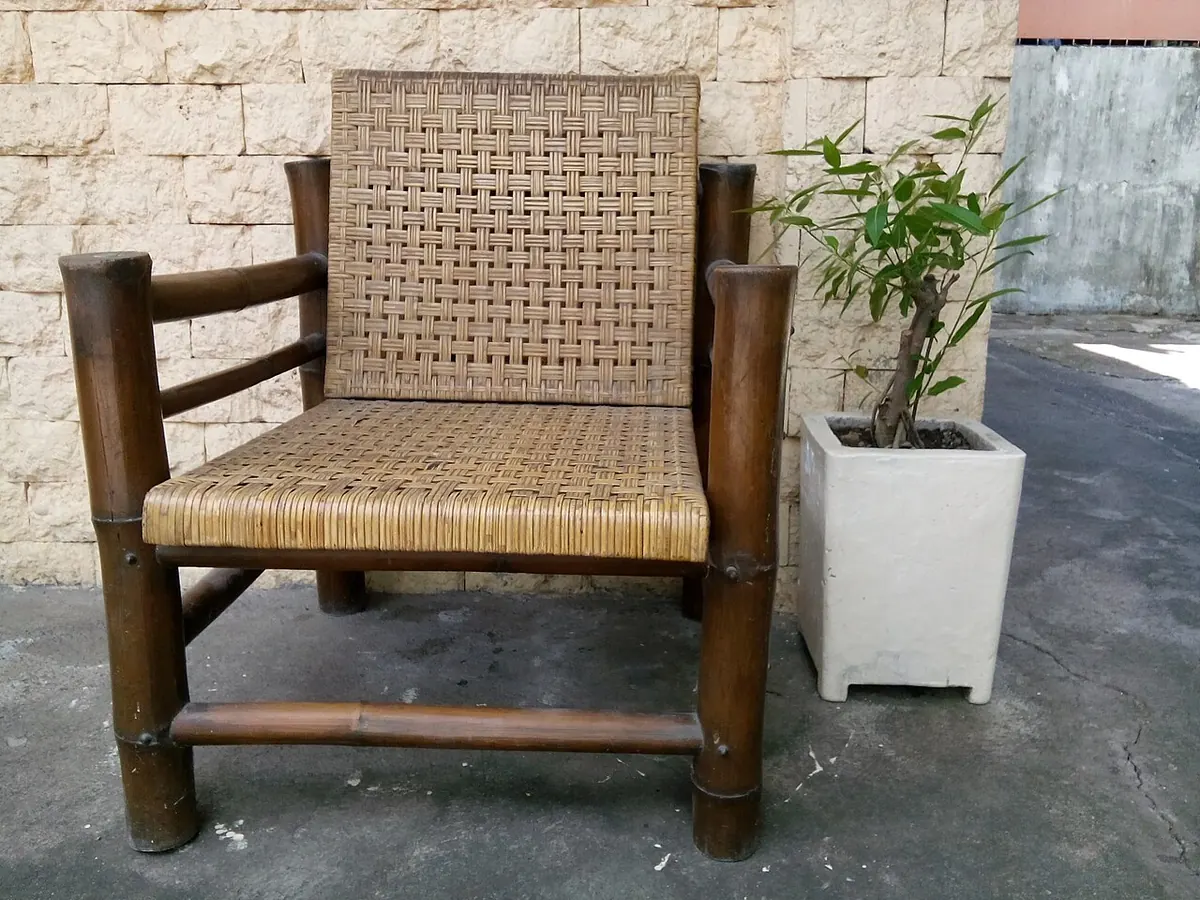 Bamboo frame armchair with a woven rattan seat and back