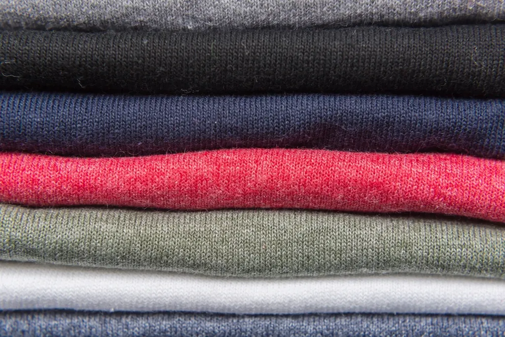 Stack of folded cotton T-shirts in several colours