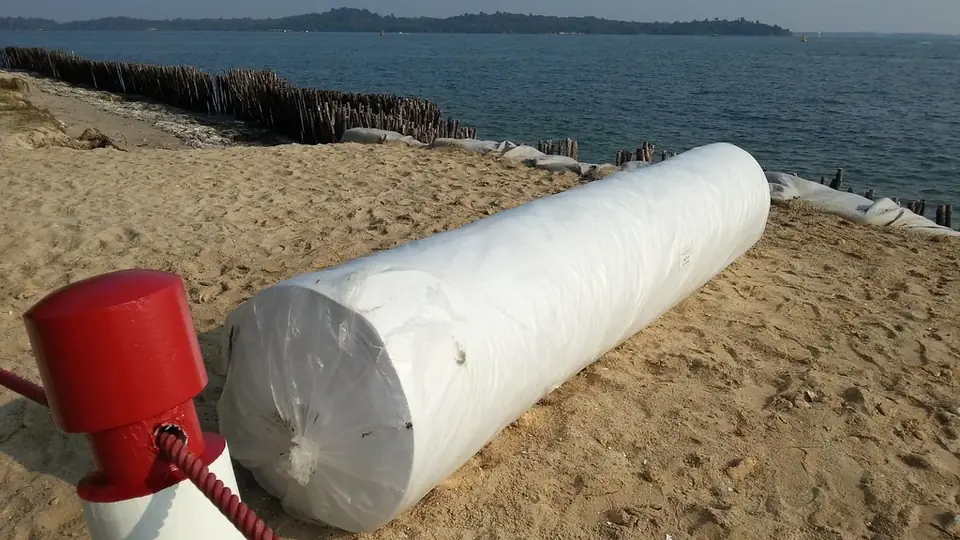 Large roll of geotextile to let water through but hold back the sand / coastline