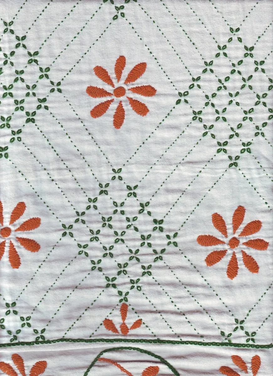 White nakshi kantha with orange flowers and green running stitch