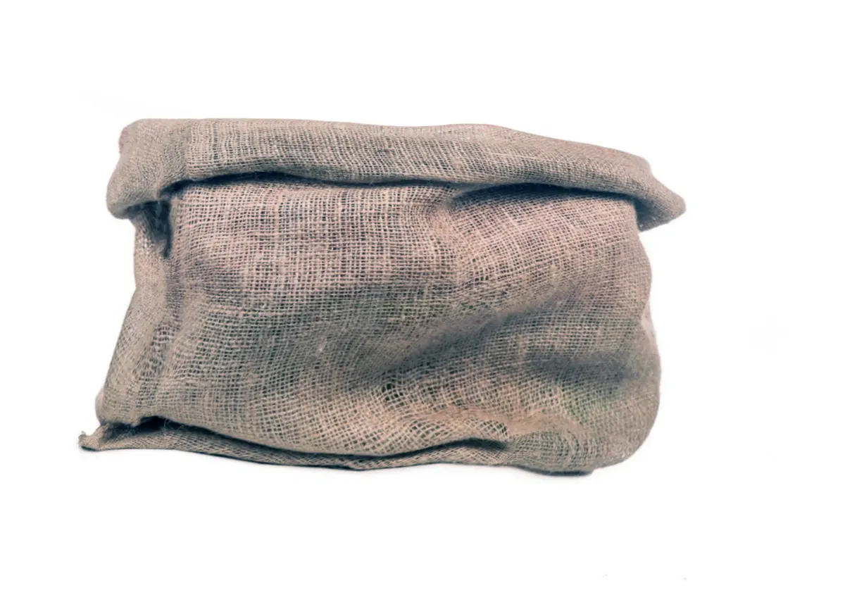 Used jute gunny sack on a white background