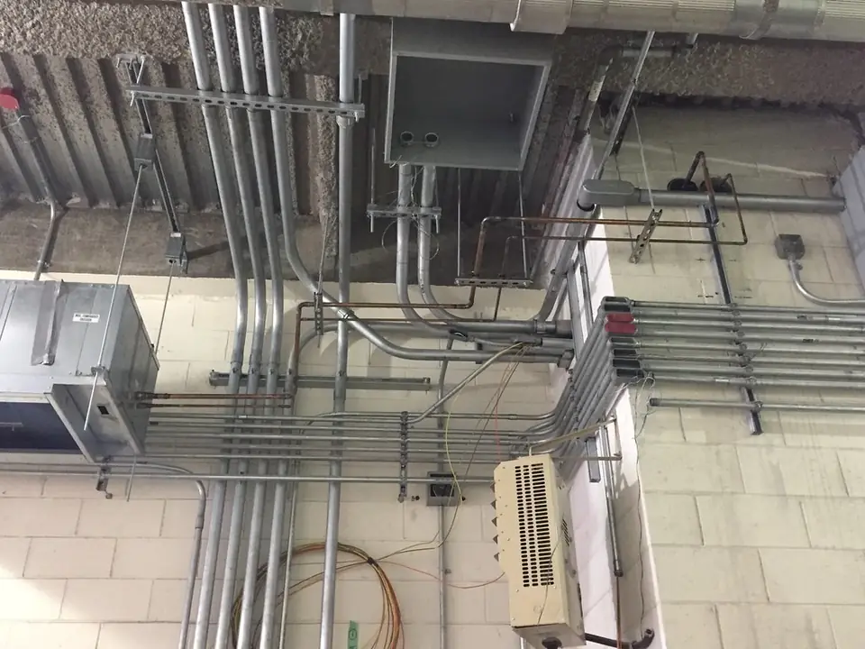 Supply and return conduit for an air conditioning unit installed in the 50th Street ventil