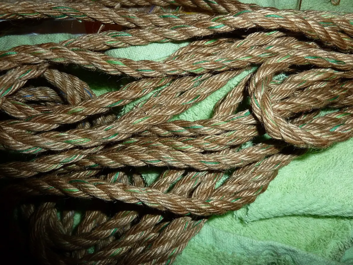 Coiled jute rope decorated with green yarn