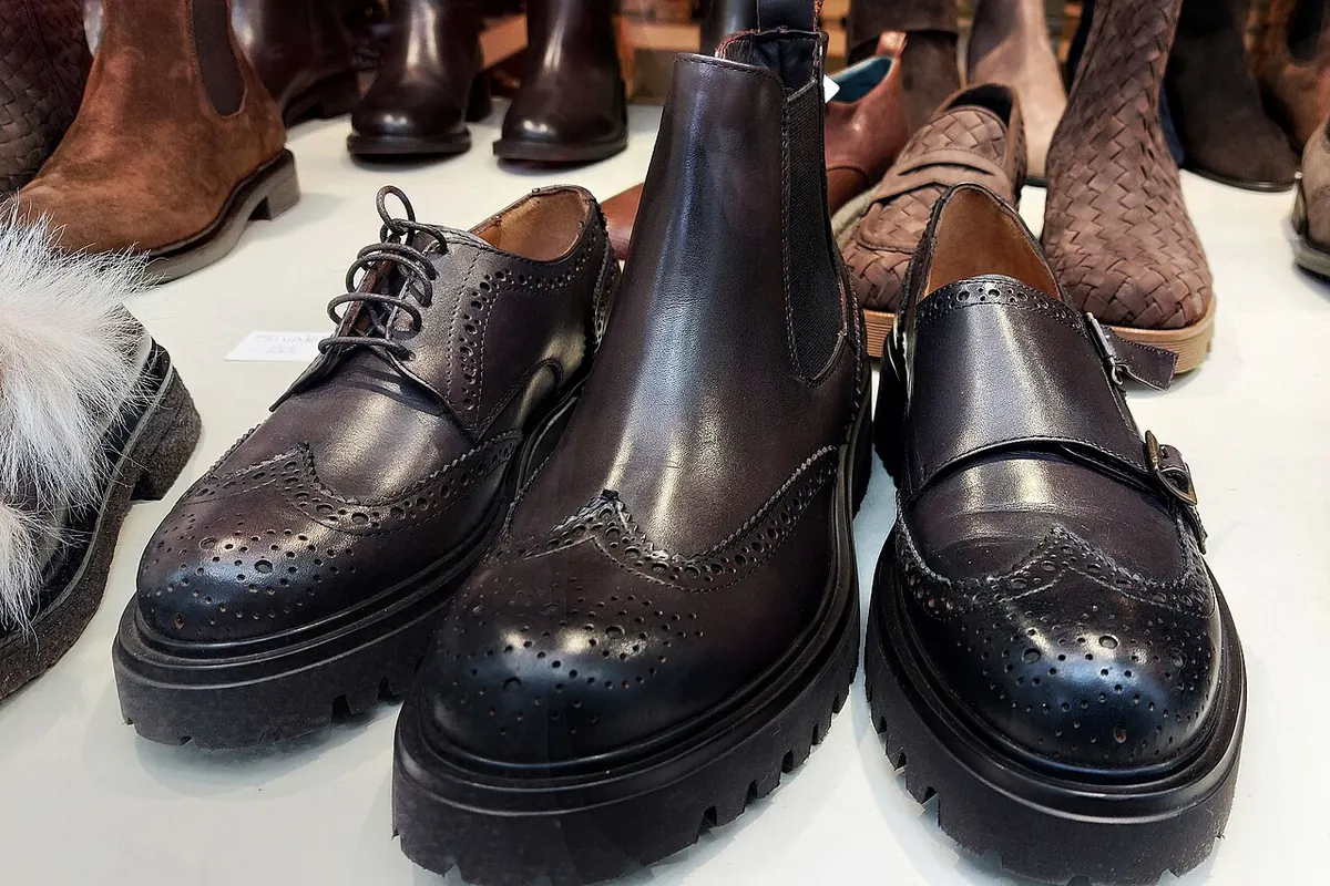 Dark brown leather brogues, monk straps and boots on display