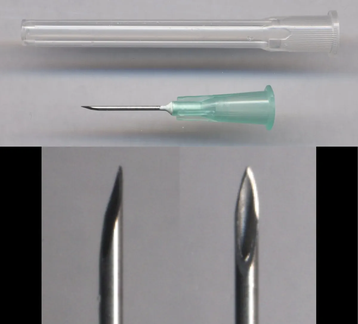 Hypodermic needle with a green hub beside its clear cap