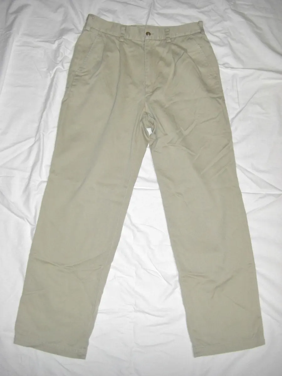 Khaki chino trousers laid flat on a white sheet