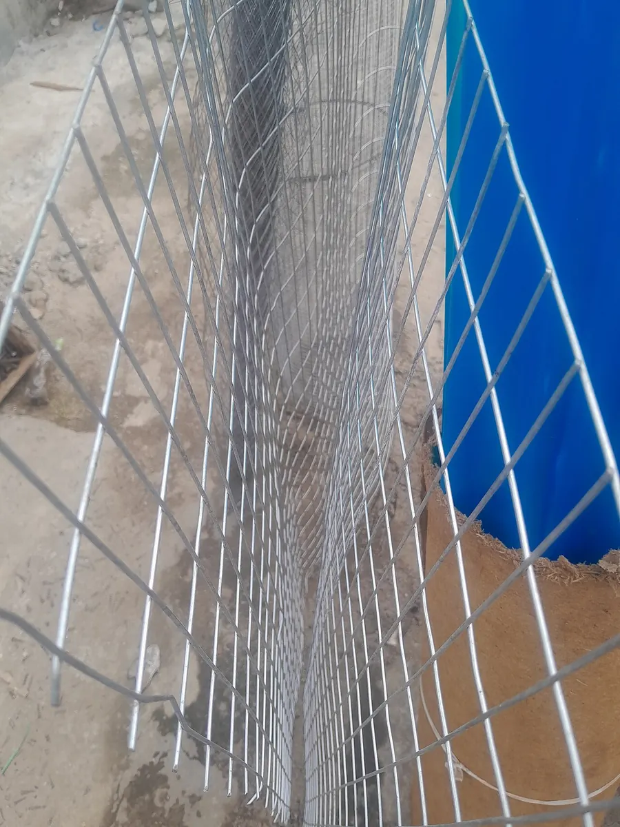 Rolls of galvanised steel wire mesh at a market
