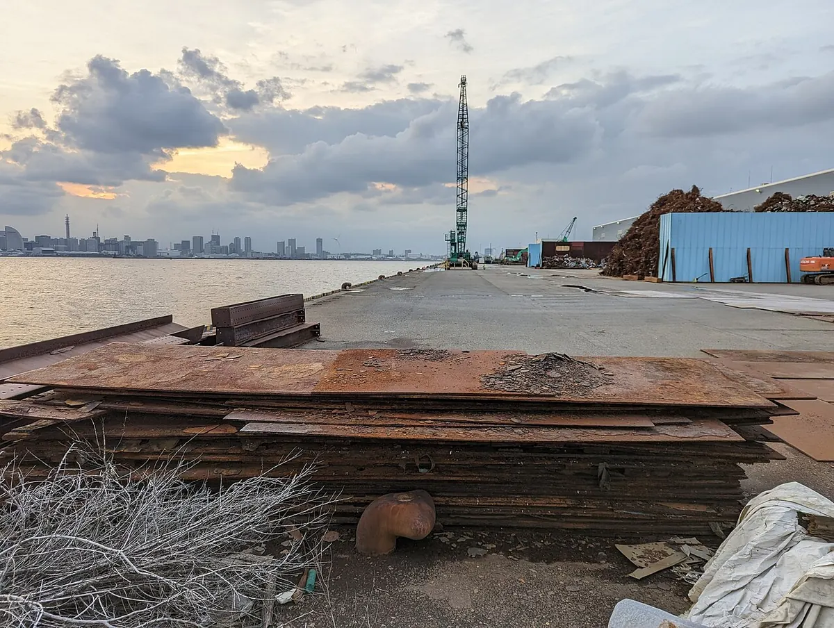 Rusty heavy steel plate scrap stacked at a port yard