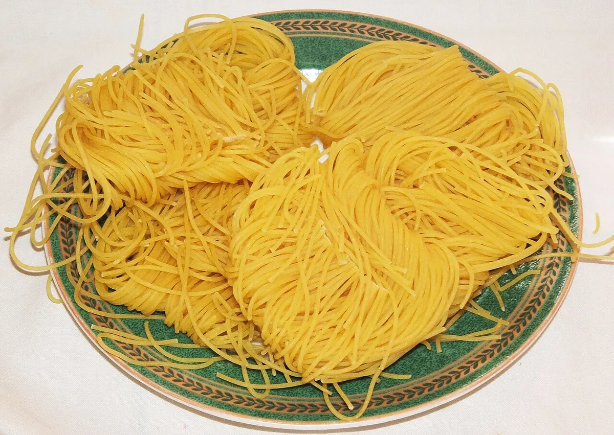 Nests of thin yellow vermicelli on a plate