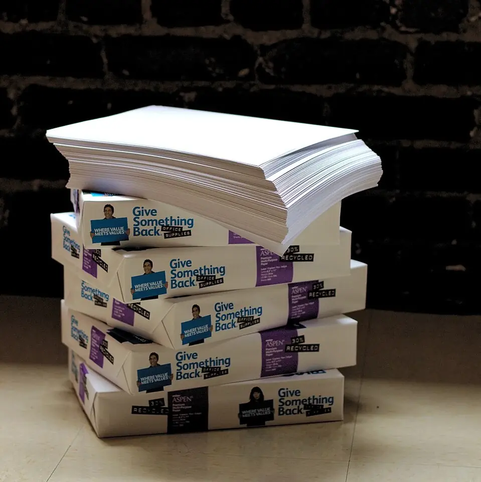 reams of paper stacked on the floor