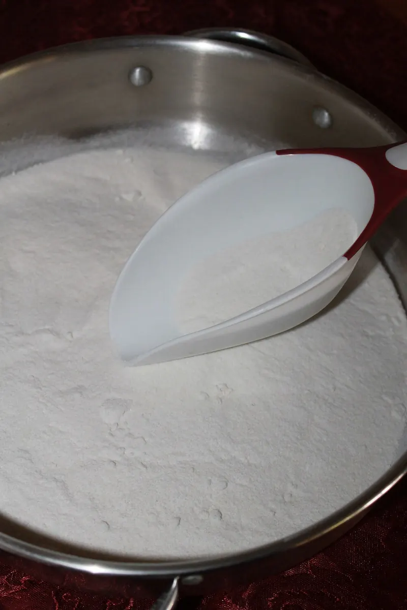 Rice flour in a steel bowl with a scoop