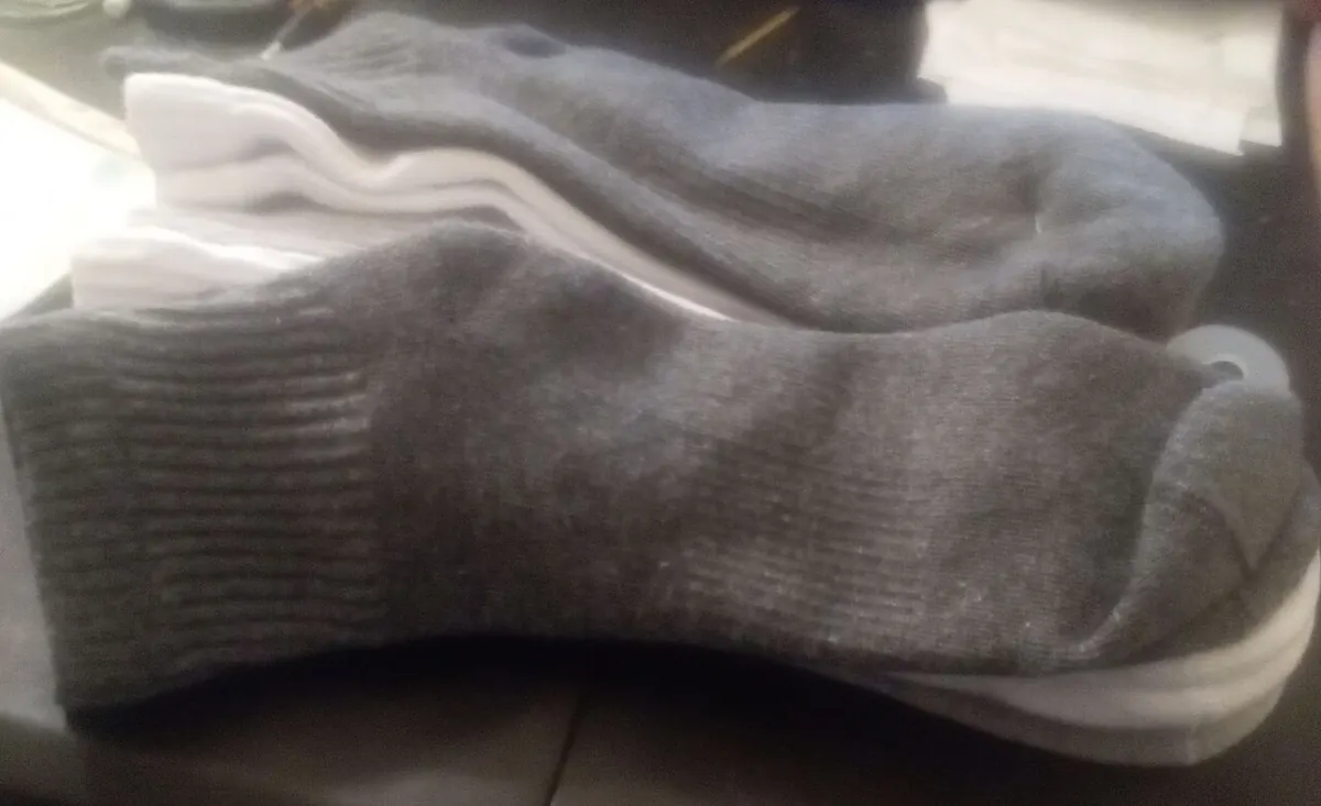 Stacked grey and white cotton ankle socks