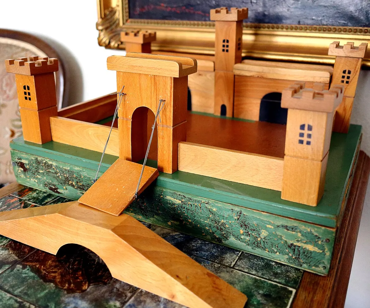 Wooden toy castle with towers and a drawbridge