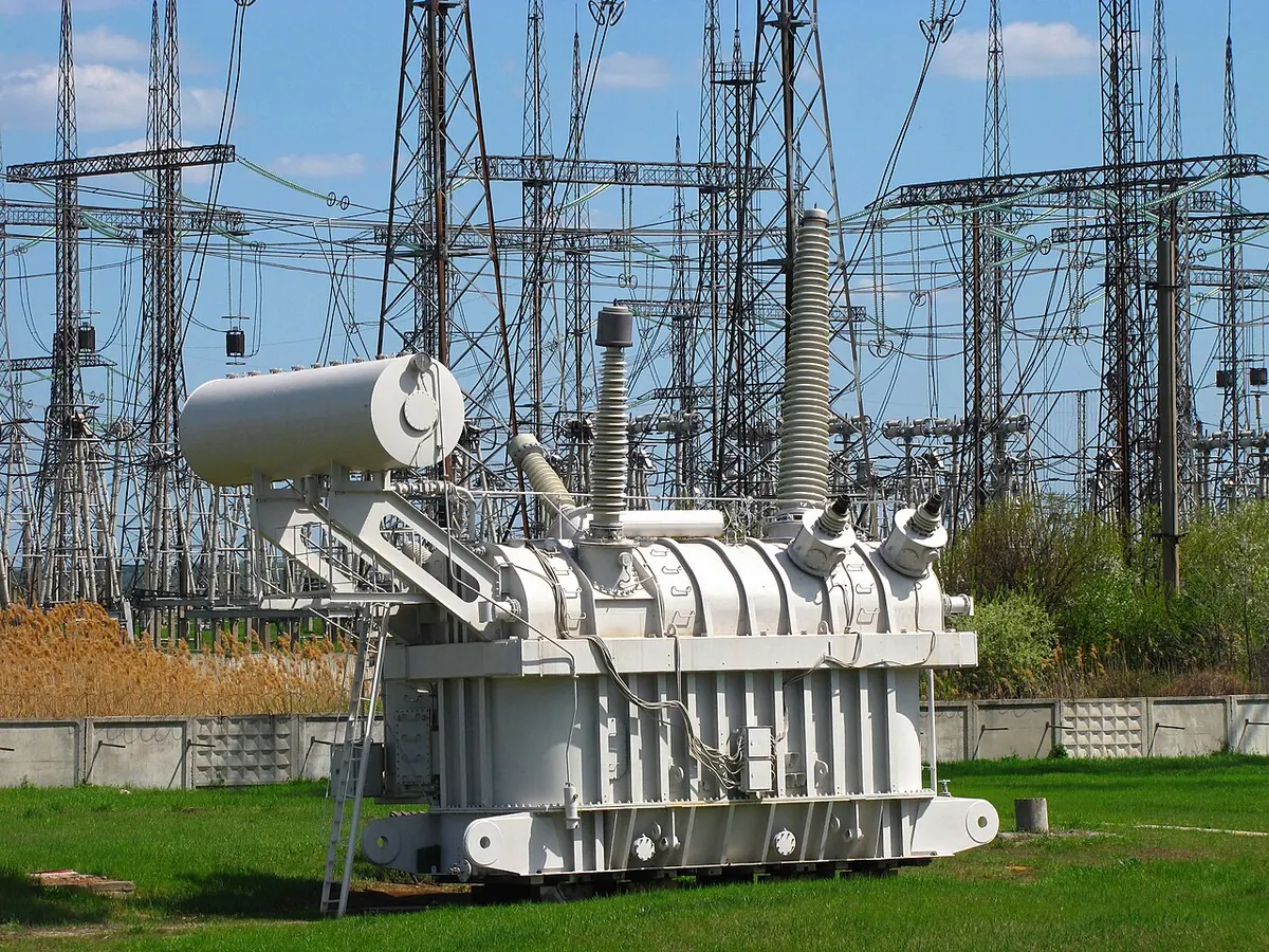 Large power transformer standing in a high voltage substation