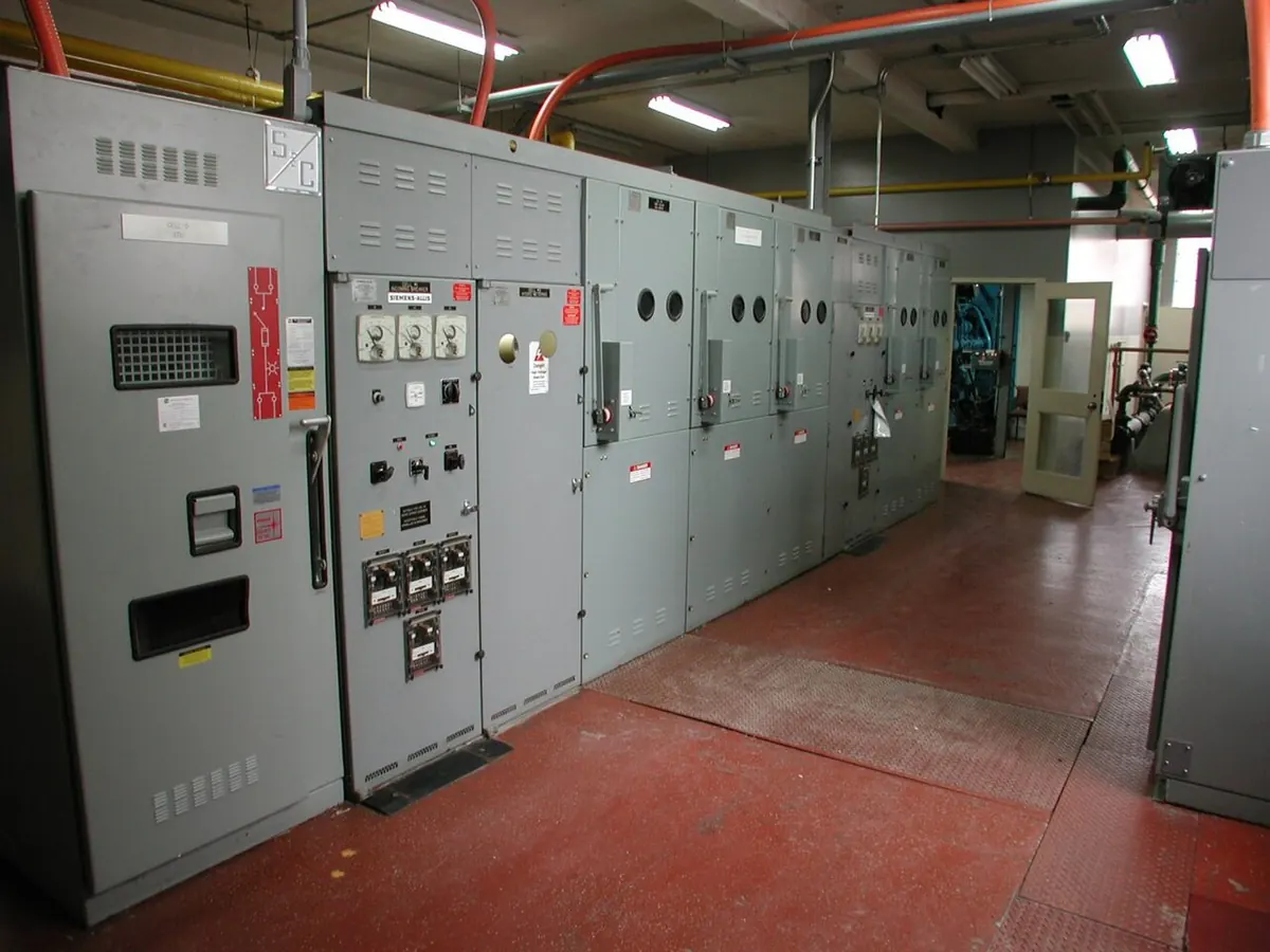 Row of grey switchgear panels in an electrical room